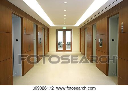 Stock Image - Empty hallway between elevators. Fotosearch