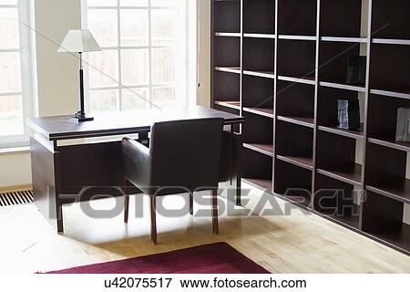 Stock Photo - Empty wooden shelves in home office. Fotosearch