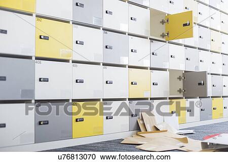 Files fallen in locker room at creative office View Large Photo Image Stock Image - Files fallen in locker room at creative office. Fotosearch