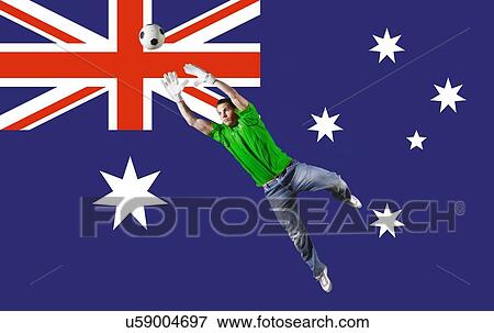 Football Goalkeeper saving shot in front of Australian National Flag View Large Photo Image Stock Photo - Football Goalkeeper saving shot in front of Australian National Flag. Fotosearch