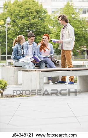 Group of friends studying together at college campus View Large Photo Image Stock Image - Group of friends studying together at college campus. Fotosearch