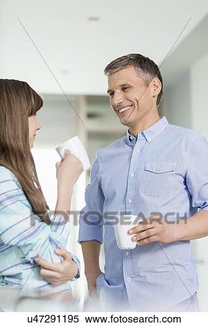 Happy father and daughter having coffee together at home View Large Photo Image Stock Photography - Happy father and daughter having coffee together at home. Fotosearch