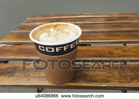 Stock Photograph - Latte with a leaf pattern on table. Fotosearch