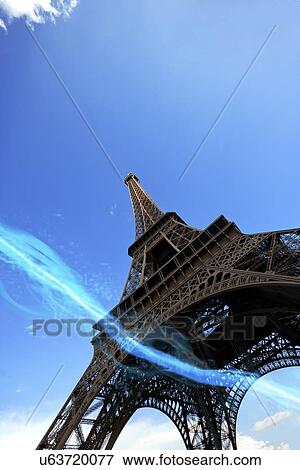 Low angle view of blue streak of lights passing under Eiffel Tower View Large Photo Image Stock Photo - Low angle view of blue streak of lights passing under Eiffel Tower. Fotosearch