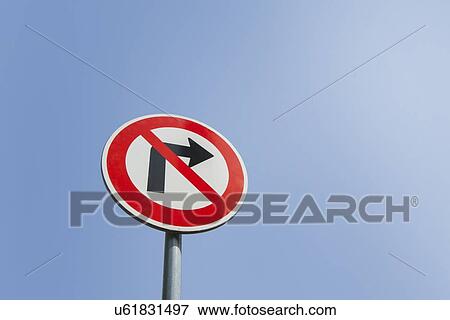 Stock Photo - Low angle view of no right turn sign against clear sky. Fotosearch