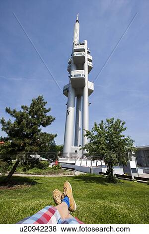 Low section of man relaxing in front of Zizkov Television Tower in Prague, Czech Republic View Large Photo Image Stock Photo - Low section of man relaxing in front of Zizkov Television Tower in Prague, Czech Republic. Fotosearch