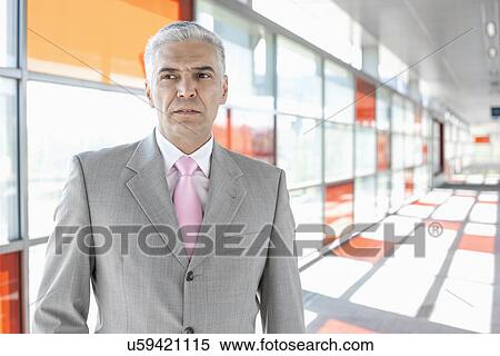 Middle aged businessman at railroad station View Large Photo Image Stock Photography - Middle aged businessman at railroad station. Fotosearch