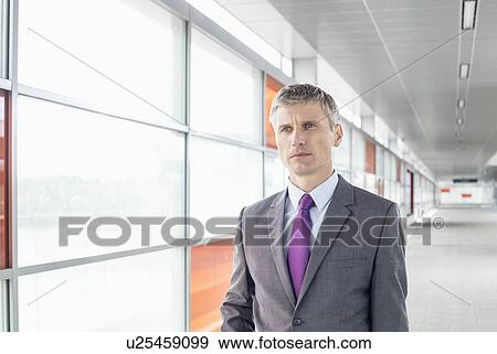 Middle aged businessman at train station View Large Photo Image Stock Photo - Middle aged businessman at train station. Fotosearch