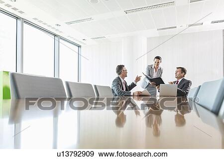 Midsection of young businesswoman using copy machine in office View Large Photo Image Stock Photo - Midsection of young businesswoman using copy machine in office. Fotosearch