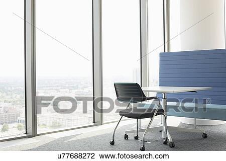 Office furniture near window View Large Photo Image Stock Image - Office furniture near window. Fotosearch