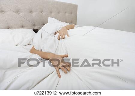 Sacred woman lying in bed View Large Photo Image Stock Image - Sacred woman lying in bed. Fotosearch