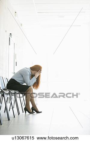 Side view of frustrated businesswoman sitting on chair in office View Large Photo Image Stock Photography - Side view of frustrated businesswoman sitting on chair in office. Fotosearch