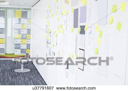 Sticky notepapers on wall in creative office space View Large Photo Image Stock Photo - Sticky notepapers on wall in creative office space. Fotosearch
