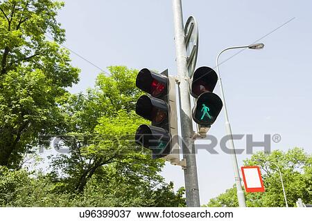 Stock Photo - Traffic signal and street light against clear sky, Prague, Czech Republic. Fotosearch