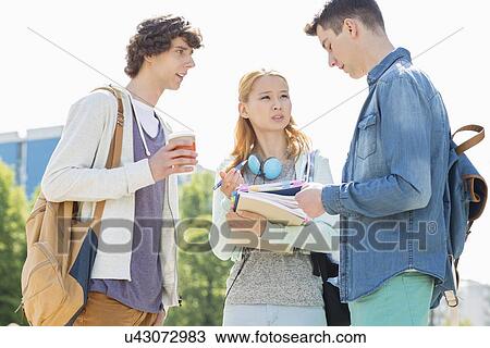 University students conversing at campus View Large Photo Image Stock Image - University students conversing at campus. Fotosearch