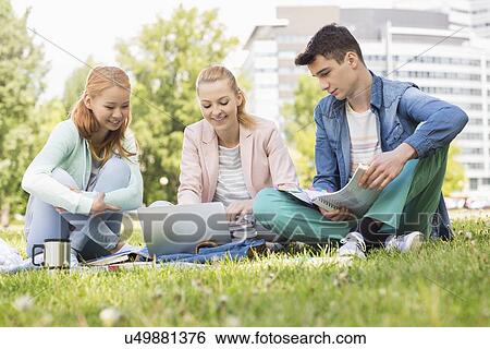 University students studying on campus View Large Photo Image Stock Photograph - University students studying on campus. Fotosearch