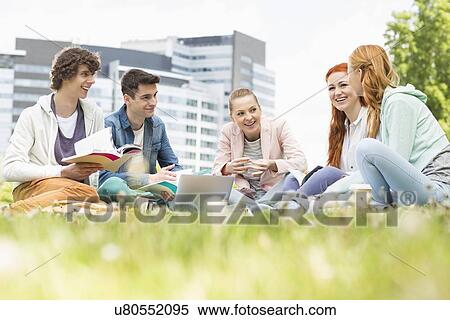 University students studying together on grass View Large Photo Image Stock Photography - University students studying together on grass. Fotosearch