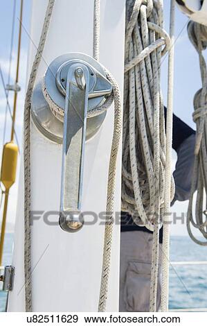 Winch handle and rope on yacht View Large Photo Image Stock Photo - Winch handle and rope on yacht. Fotosearch
