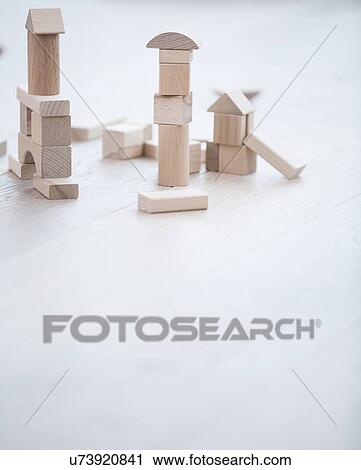 Wooden building blocks on hardwood floor View Large Photo Image Stock Image - Wooden building blocks on hardwood floor. Fotosearch