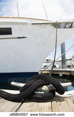 Stock Photo - Yacht moored to a pontoon. Fotosearch