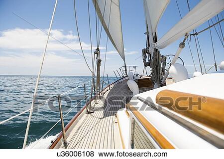 Yacht sailing in sea View Large Photo Image Stock Photo - Yacht sailing in sea. Fotosearch