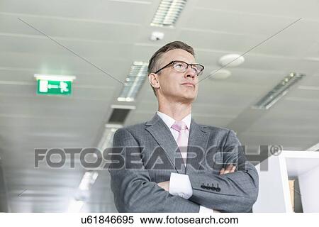 Young businesswoman using laptop in office View Large Photo Image Stock Photography - Young businesswoman using laptop in office. Fotosearch