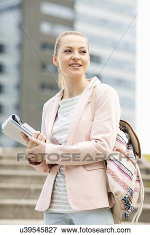 Stock Photo - Young female student at college campus. Fotosearch