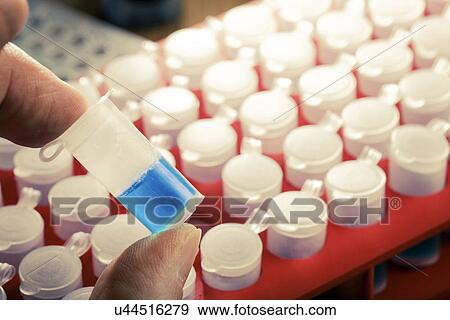 Stock Photo - Blue water in a test tube. Fotosearch