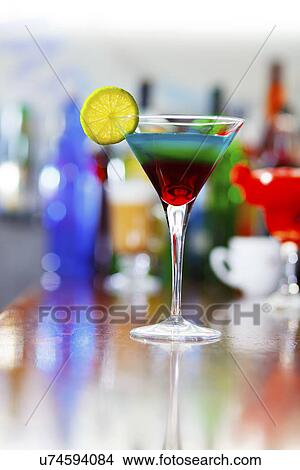 Picture - Cocktail glass on a bar. Fotosearch