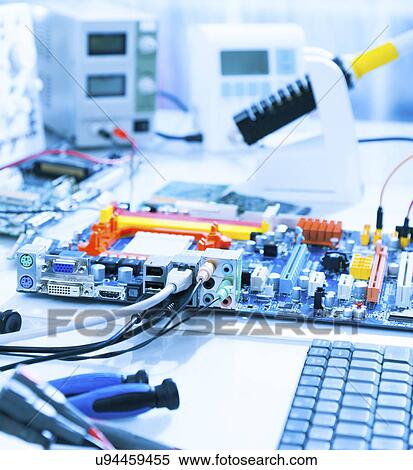 Stock Photography - Computers in a repair workshop. Fotosearch