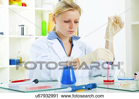 Female technician working in lab View Large Photo Image Stock Image - Female technician working in lab. Fotosearch