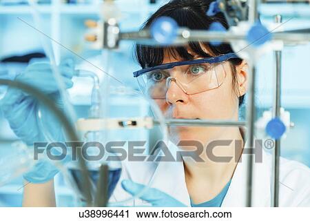 Stock Image - Lab technician using Lab equipment. Fotosearch