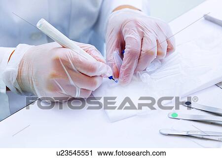 Lab technician writing on test tube View Large Photo Image Stock Image - Lab technician writing on test tube. Fotosearch