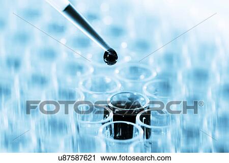 Stock Image - Micro pipette and test tube. Fotosearch