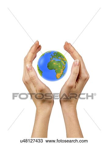 Stock Image - Person holding the globe in their hands. Fotosearch