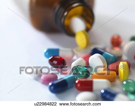 Pill bottle with pills View Large Photo Image Stock Image - Pill bottle with pills. Fotosearch