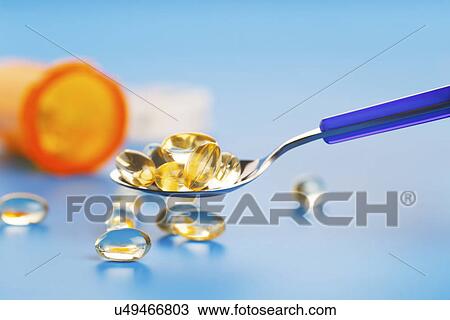 Spoon with capsules View Large Photo Image Stock Image - Spoon with capsules. Fotosearch
