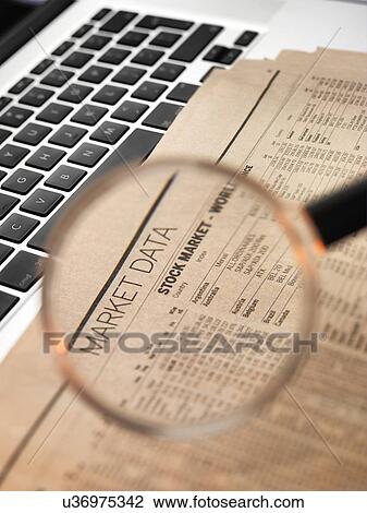 Drawing - Stock market figures and magnifying glass. Fotosearch