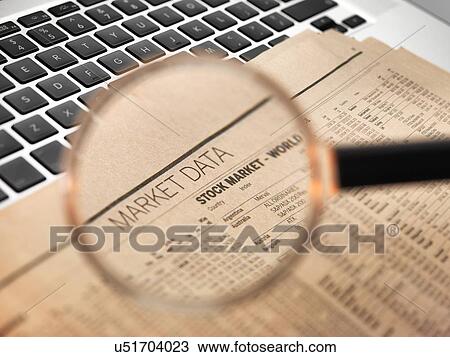 Drawing - Stock market figures and magnifying glass. Fotosearch