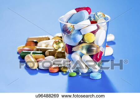 Stock Photo - Tablets and capsules, still life. Fotosearch