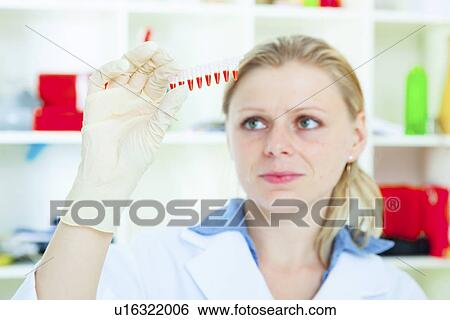 Technician holding medical samples View Large Photo Image Stock Photograph - Technician holding medical samples. Fotosearch