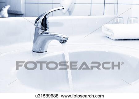 Stock Photo - Water flowing from a tap. Fotosearch