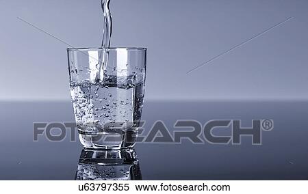 Water pouring into a glass View Large Photo Image Stock Photography - Water pouring into a glass. Fotosearch