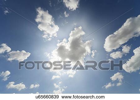 White clouds against a blue sky View Large Photo Image Stock Photo - White clouds against a blue sky. Fotosearch