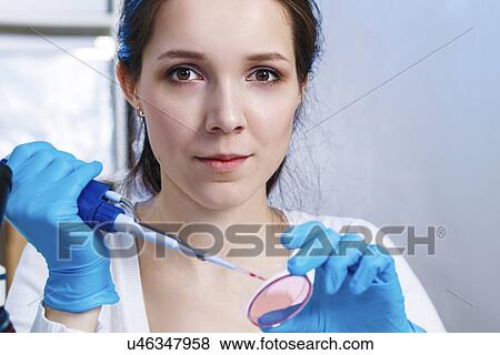 Woman holding pipette and petri dish View Large Photo Image Stock Photo - Woman holding pipette and petri dish. Fotosearch
