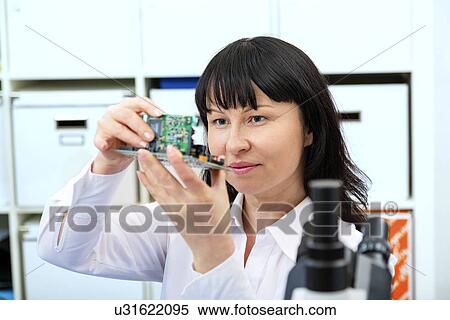 Woman making a micro processor View Large Photo Image Stock Photography - Woman making a micro processor. Fotosearch