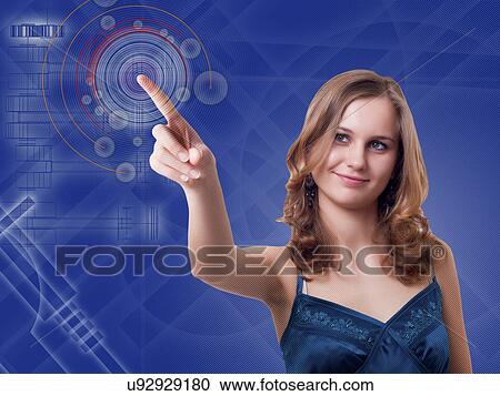 Stock Image - Woman using touchscreen technology. Fotosearch