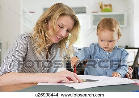 Picture - Baby girl drawing with mother. Fotosearch