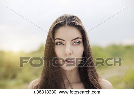 Stock Image - Bare shoulder portrait of beautiful young woman. Fotosearch