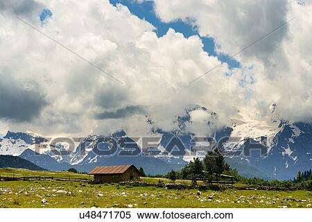 Stock Photography - Barn and distant mountains, Mazeri village, Svaneti, Georgia. Fotosearch